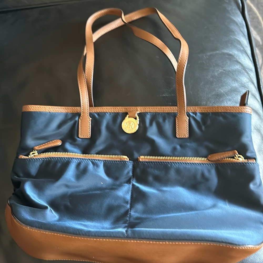 Michael Kors handbag. Navy with two exterior zip pockets 4 interior pockets